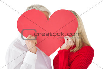 Mature couple holding heart