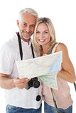 Happy mature couple looking at map