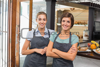 Pretty waitresses smiling at camera