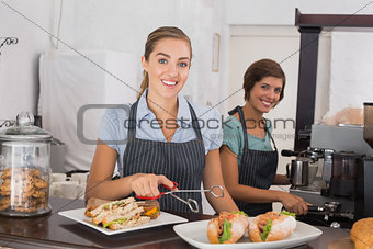 Pretty waitresses working with a smile