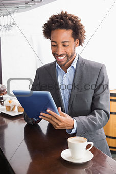 Happy businessman having a coffee