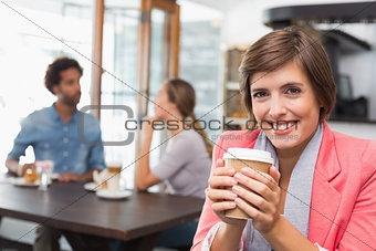 Pretty brunette enjoying her coffee
