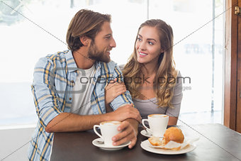 Happy couple enjoying a coffee