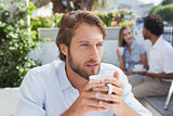 Thoughtful man having a coffee