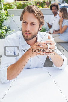 Thoughtful man having a coffee