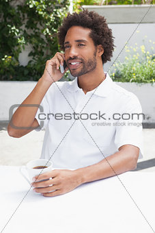Man on the phone having coffee
