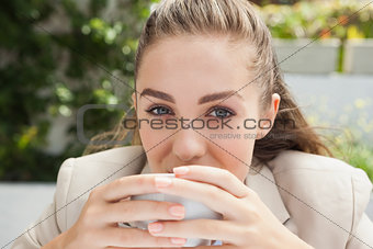 Beautiful businesswoman having a coffee