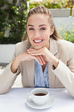 Beautiful businesswoman enjoying a coffee