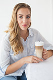 Pretty blonde enjoying a latte