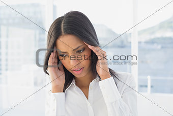 Businesswoman suffers a severe headache