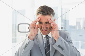 Businessman suffering from a headache