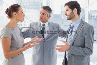 Businesswoman arguing with co-worker