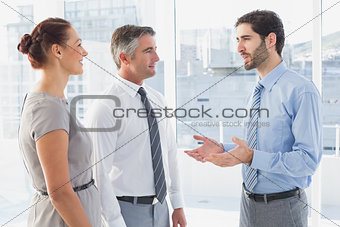 Businessman chatting with co-worker