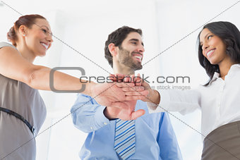 Business people with stacked hands
