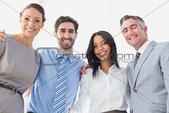 Smiling employee's standing all together