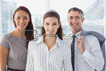 Smiling business woman with colleagues