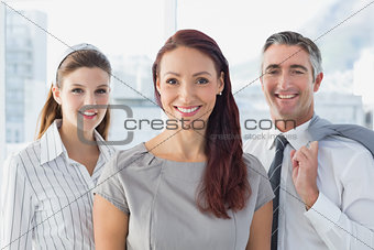 Smiling business woman with colleagues