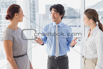 Businessman discussing work with co-workers
