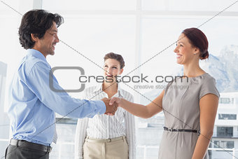 Business man shaking colleagues hand