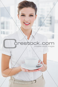 Business woman holding a cup