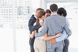 Business team all huddled together