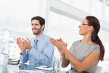 Business people applauding at meeting