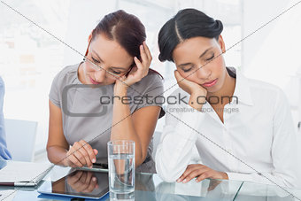 Businesswoman and her colleague sleeping