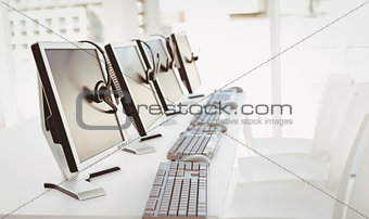Call center computers and headsets