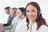 Call center workers wearing headsets