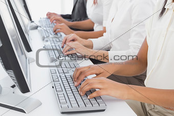 Employee's typing on their computers