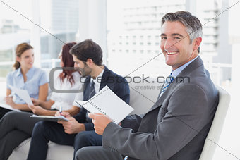 Businessman smiling at the camera