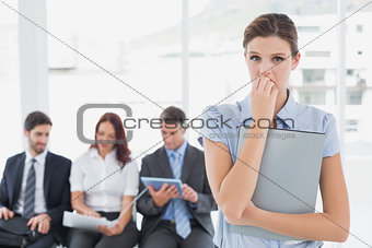 Worried businesswoman looking at camera