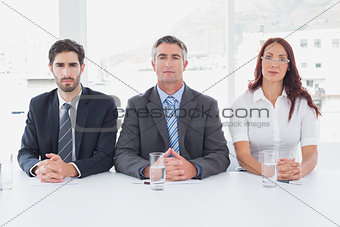 Serious business people sitting together