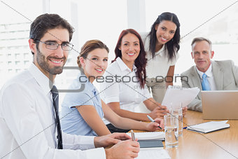 Business team smiling at camera