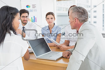 Business team discussing work details