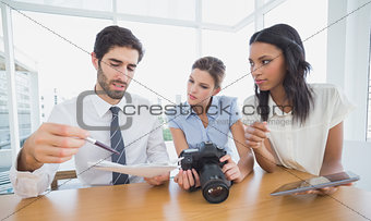 Business people using a camera