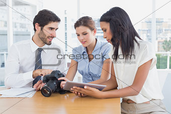 Business people using a camera