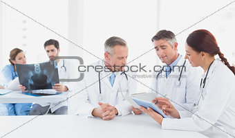 Doctors sitting together with x-rays