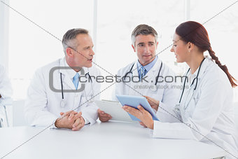 Doctors using a tablet together