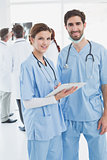 Nurses holding a file together