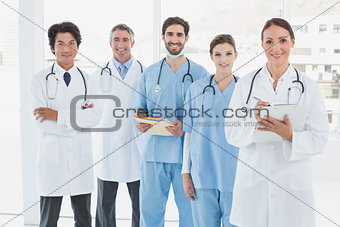 Smiling doctors all standing together