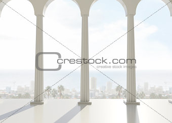 Room with pillars overlooking city and ocean