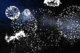 White fireworks exploding on black background