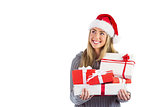 Festive blonde holding pile of gifts