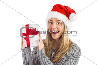 Festive blonde holding christmas gift