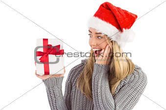 Festive blonde holding christmas gift