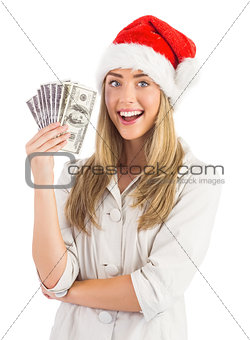 Festive blonde holding fan of dollars