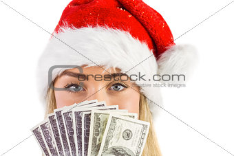 Festive blonde holding fan of dollars
