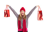 Festive blonde holding shopping bags