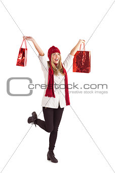 Pretty blonde carrying shopping bags